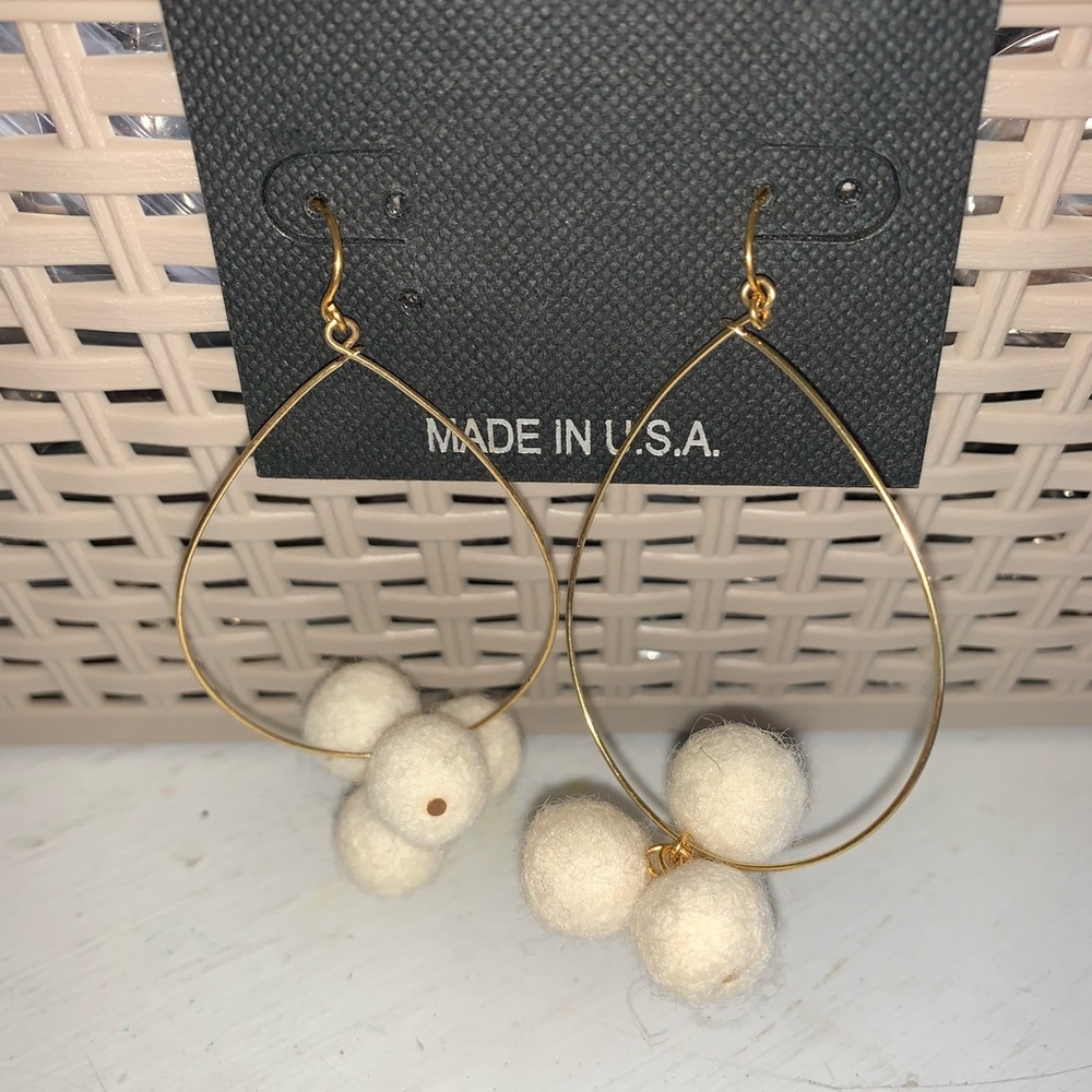 One pair Pom and goldtone 3” dangle earrings with J hooks. 4 cream poms NWT